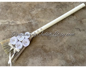 Timeless Elegance Wedding Broom with Vibrant Crystal Accents and Delicate Hand Rolled Satin Rosettes.. Shown in Ivory with White Rosettes