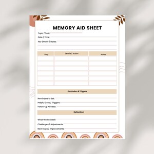 Könnte beinhalten: Ein Memory Aid Sheet mit dem Titel "MEMORY AID SHEET" in Schwarz, mit Abschnitten für Aufgaben, Daten und Notizen. Es enthält Bereiche für Schritte, Erinnerungen und Reflexion. Das Design integriert braune und beige Töne mit einem Regenbogenmotiv am unteren Rand.