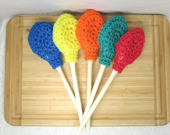 Scrubbie on a Stick. Scrubber, wood spoon,red, blue, teal, purple, yellow, orange,scour pad, eco-friendly, durable. Scrubber on a spoon.