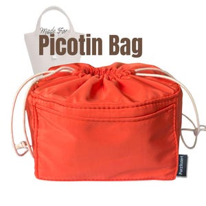 May include: Bright orange Picotin bag organizer with a drawstring closure and a front pocket. The bag has white drawstrings and a small black and white label. The text "Made For Picotin Bag" is displayed above the bag.