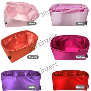 May include: Collection of colorful purse organizers in blush, pink, orange, fuchsia, violet, and scarlet. Each organizer has multiple compartments and a zippered top. The organizers are labeled with their respective color names.