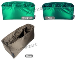 May include: Three fabric organizers in different colors. Two are a vibrant green, labeled "Evergreen" and "Pine", and the third is a neutral taupe, labeled "Etooupe". Each organizer has multiple compartments for storage.