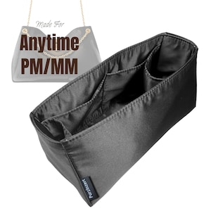 May include: A black fabric handbag organiser insert with multiple interior compartments and a small side pocket. The insert features a small black tag with the text PurzInzert. A graphic overlay shows a handbag outline with the text Made For Anytime PM/MM.