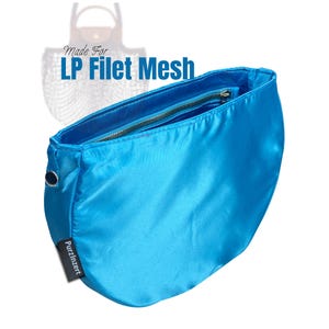 May include: A bright turquoise bag with a zipper closure and a small black tag that reads "PurzInzert." The text "Made For LP Filet Mesh" is visible in the background. The bag is made of a smooth, shiny material.