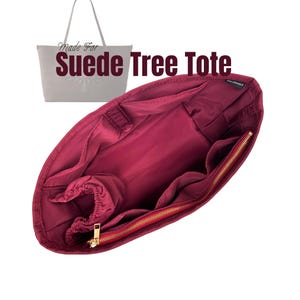 May include: Burgundy tote bag organizer with multiple pockets and a gold zipper. The organizer is designed to fit inside a larger tote bag. The text "Suede Tree Tote" is visible.