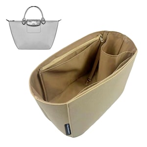 May include: Beige felt handbag organizer with multiple compartments, including a zippered pocket and open pockets. A sketch of a matching handbag is in the upper left corner. The organizer is designed to fit inside a tote bag.