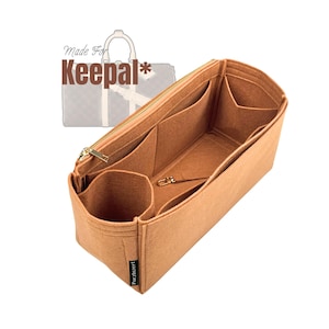 May include: A tan felt bag organizer with multiple compartments and a gold zipper. The organizer is designed to fit inside a Keepall bag. The text "Made For Keepal*" is visible in the image.