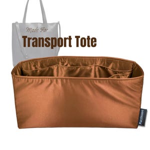 May include: A brown tote bag organizer with multiple compartments. The text "Made For Transport Tote" is visible. A small tag with the text "PurzInzert" is on the right side.