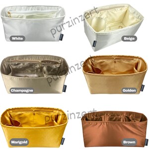 May include: A collection of handbag organizers in various colors: white, beige, champagne, golden, marigold, and brown. Each organizer has multiple compartments and a zippered pocket. The organizers are made of a smooth, possibly satin-like material.