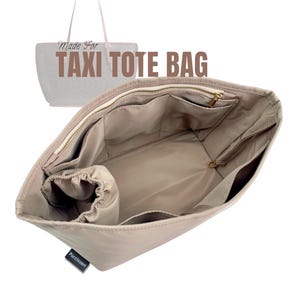 May include: Beige taxi tote bag organizer with multiple pockets and a zippered closure. The text "Made For TAXI TOTE BAG" is visible. The organizer has a drawstring pouch and a label that reads "Purzinzert".