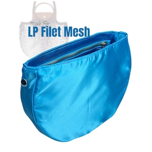 May include: A vibrant turquoise handbag with a zip closure. The bag is made of a smooth, shiny material and has a rounded shape. The text "Made For LP Filet Mesh" is visible in the background.