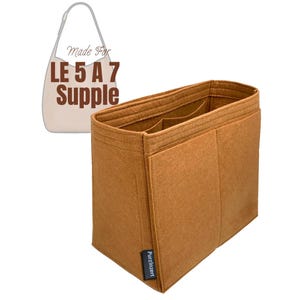 May include: A brown felt bag organizer with multiple compartments. The organizer is designed to fit inside a handbag. The text "Made For LE 5 A 7 Supple" is visible in the image. The brand name "Purzinzert" is printed on a small tag.