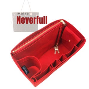 May include: A red felt bag organizer with multiple compartments and a zippered top. The organizer includes a small pocket with a snap closure and a key holder. The text "Made For Neverfull" is visible in the background.