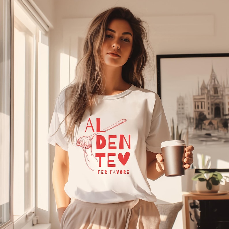 May include: White t-shirt with a red graphic that says "Al Dente Per Favore" and a drawing of spaghetti with a fork.