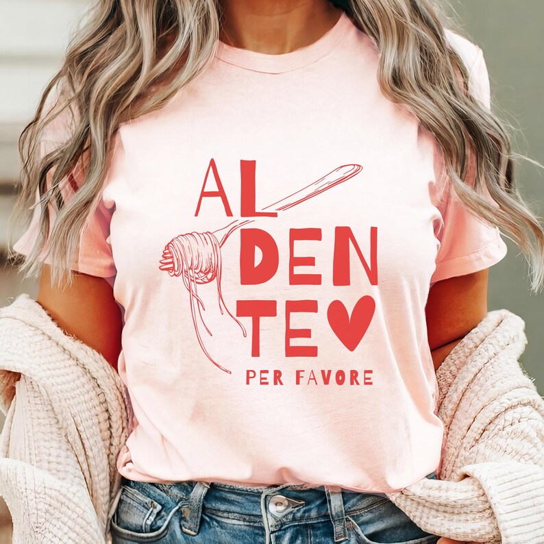 May include: Pink t-shirt with a graphic of a fork and spaghetti with the text "AL DENTE PER FAVORE" in red.