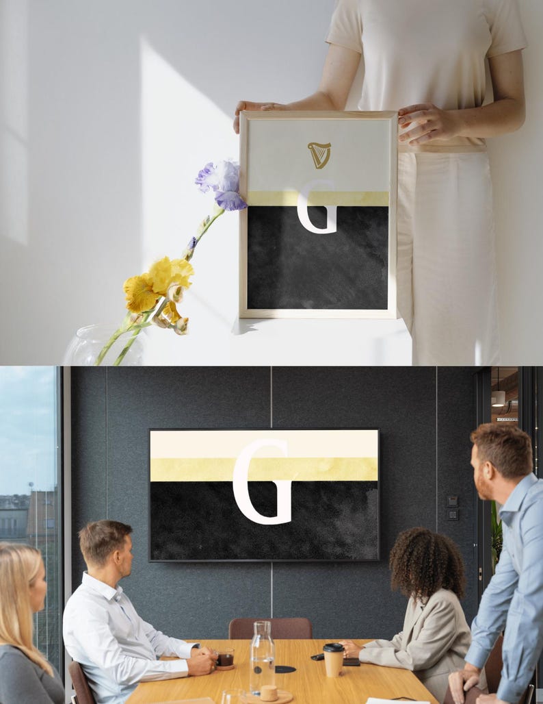 May include: A black and white abstract art print with a gold harp and the letter "G" in white. The print is framed in a light wood frame and is hanging on a wall.