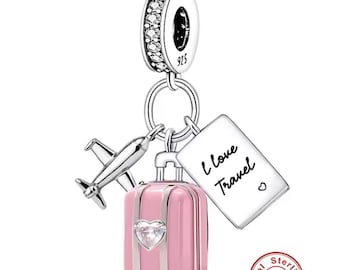 May include: Silver charm with a pink suitcase, airplane, and a tag that says "I love Travel".