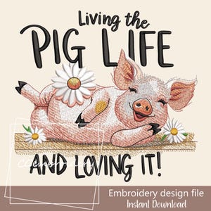 May include: An embroidery design file with a cartoon pig illustration. The pig is pink and white, lying down with a daisy on its back. The text reads "Living the Pig Life and Loving It!" with additional text at the bottom.