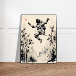 May include: A framed art print depicts an astronaut floating in a bamboo forest. The astronaut is in a white spacesuit with arms outstretched. The artwork is in black and white with a cream-colored background.