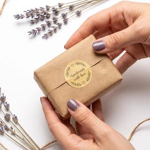 A hand holding the Ginger Soap for Acne and Dark Spots, Natural Soap Bar, Deodorizing Body, Anti-Inflammatory Skincare