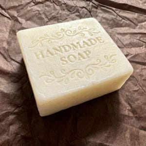 A hand holding the Ginger Soap for Acne and Dark Spots, Natural Soap Bar, Deodorizing Body, Anti-Inflammatory Skincare