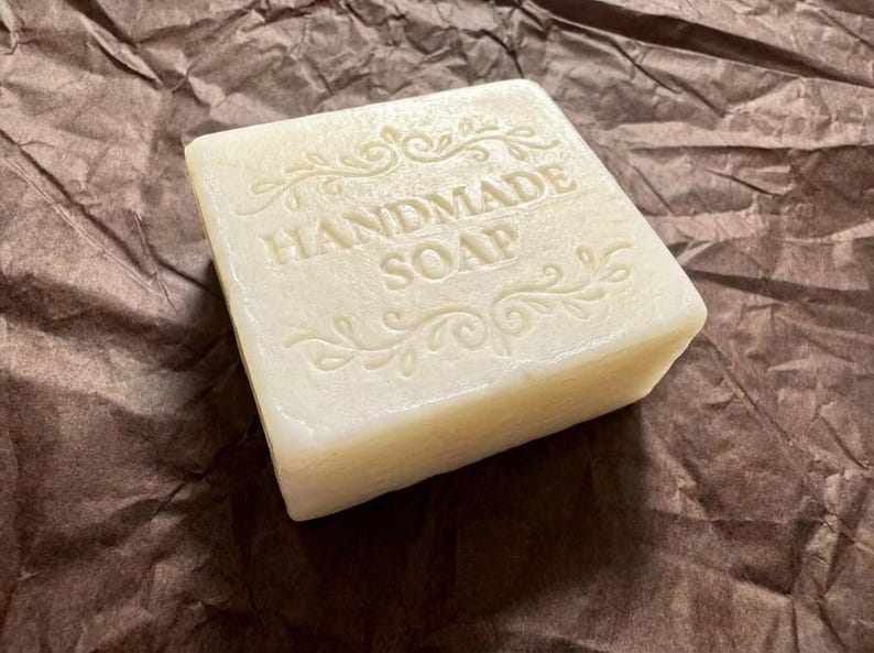 A hand holding the Ginger Soap for Acne and Dark Spots, Natural Soap Bar, Deodorizing Body, Anti-Inflammatory Skincare