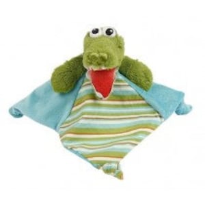 May include: A plush green alligator baby lovey with a red mouth and large eyes. The lovey has a blue and striped patterned blanket, perfect for snuggling. The toy is designed for infants and toddlers.
