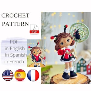 May include: A crochet pattern for a doll in a ladybug costume. The doll has a red and black outfit, black boots, and brown hair with antennae. The image includes the text "CROCHET PATTERN" and "PDF in English, Spanish, French."