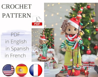 May include: Crochet pattern PDF for a Christmas elf doll with brown hair, wearing a green and white striped outfit, a red hat, and holding a string of lights. The pattern is available in English, Spanish, and French.