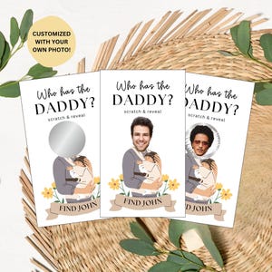 May include: Three rectangular scratch and reveal game cards titled Who has the DADDY? featuring an illustration of a person carrying a baby in a carrier. The cards display yellow flowers, a banner with the text FIND JOHN, and a circular scratch-off area.
