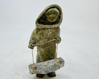 Inuit Handmade Sculpture of Standing Woman with Bedroll by Arci Ishulutuq