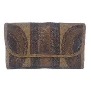 May include: A rectangular clutch bag featuring a textured, snakeskin-like pattern in alternating vertical stripes of dark brown and light tan. The flap closure is integrated into the overall design, maintaining the consistent color-blocked pattern.