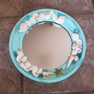 Round teal blue seashell mirror