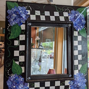 Hydrangeas and checkered decorative mirror