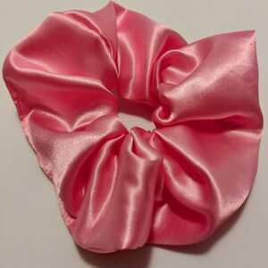 medium pink satin  scrunchie, shiny and smooth satin hair tie. crease free hair tie for comfort and style. Elevate your style. fashionable.