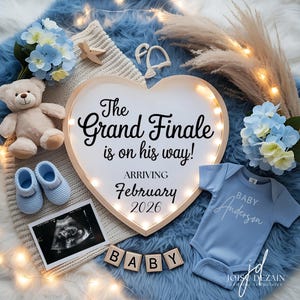 May include: A heart-shaped sign with the text "The Grand Finale is on his way!" and "Arriving February 2026". The image includes a baby onesie, ultrasound image, baby shoes, and a teddy bear, all in shades of blue.