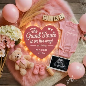 May include: A pink baby announcement with balloons, a teddy bear, and a onesie. The announcement includes a sonogram, baby booties, and a heart-shaped sign that reads "The Grand Finale is on her way!" arriving March 2026. The word "GIRL" is spelled out.