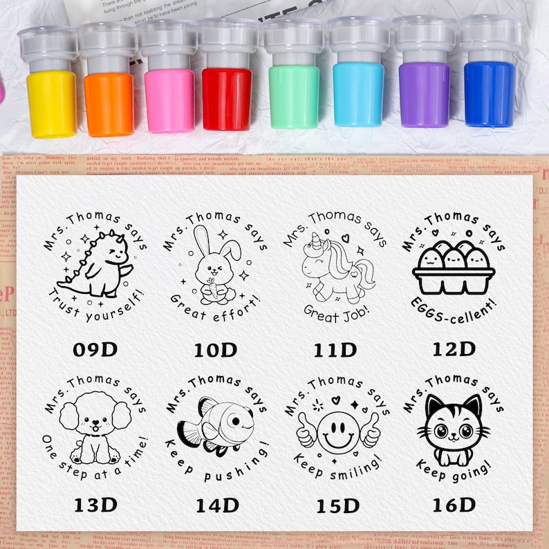 May include: A set of colorful self-inking stamps with various designs and encouraging messages. The stamps feature cartoon animals and phrases like "Trust yourself!" and "Great effort!" The stamp colors include yellow, orange, pink, red, green, blue, purple, and blue.