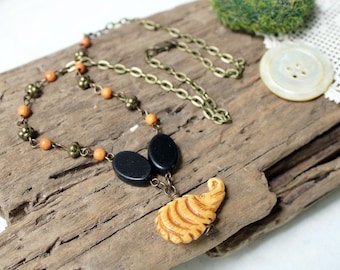 Hedgehog Necklace - bone pendant, black, orange, antiqued brass, wood, cute critter, animal, handmade jewelry