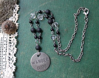 Wander Necklace - Tim Holtz word tag, glass beads, black and clear, simple, short, antiqued silver
