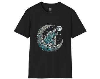 May include: Black t-shirt featuring a detailed graphic of a howling wolf inside a crescent moon. The design incorporates floral and star elements, with the wolf and moon rendered in shades of teal and white. The shirt is a classic crew neck.