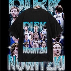 May include: Black t-shirt featuring a collage of photos of Dirk Nowitzki, a basketball player, wearing a Dallas Mavericks jersey. The text "Dirk Nowitzki" is printed in white on the shirt.