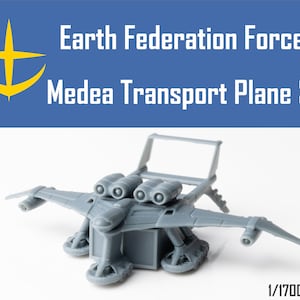 Op de afbeelding: Een grijs plastic model van een Medea-transportvliegtuig van de Aarde Federatie Krachten, op schaal 1/1700.