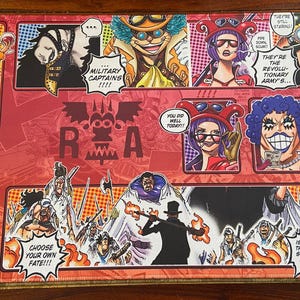 May include: A rectangular playmat featuring colorful illustrations of anime characters. The design includes comic-style panels with text like "MILITARY CAPTAINS" and "CHOOSE YOUR OWN FATE!!!". The dominant colors are red, orange, and white.