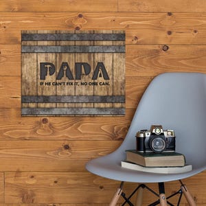 Each letter in the bold word PAPA includes the silhouette of a hand tool as part of the letter.  Beneath the word PAPA is the phrase “If he can’t fix it, no one can.” The background looks like aged vertical boards similar to a flattened oak barrel. At the top and bottom are aged metal strips. This is a perfect gift for anyone’s husband, dad, stepdad, grandpa, or favorite male friend who has tools and knows who to fix things. NOTE: This is a flat metal sign, not real wood or metal.