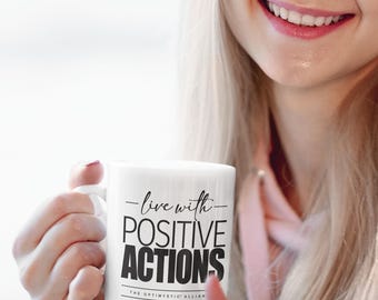 POSITIVE ACTIONS make a positive impact on the world. Remind yourself with this sturdy ceramic motivational mug.