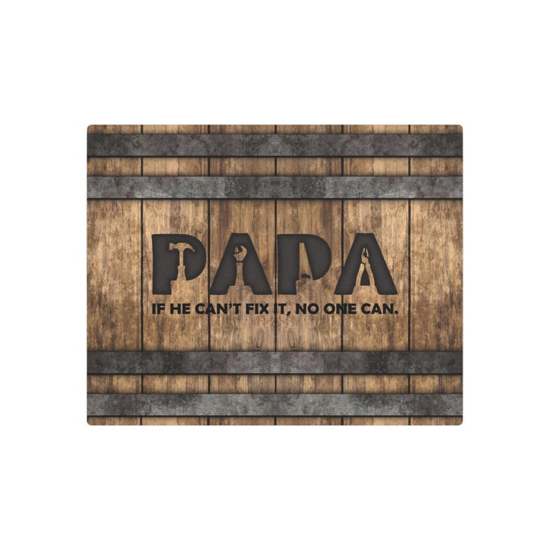 Each letter in the bold word PAPA includes the silhouette of a hand tool as part of the letter.  Beneath the word PAPA is the phrase “If he can’t fix it, no one can.” The background looks like aged vertical boards similar to a flattened oak barrel. At the top and bottom are aged metal strips. This is a perfect gift for anyone’s husband, dad, stepdad, grandpa, or favorite male friend who has tools and knows who to fix things. NOTE: This is a flat metal sign, not real wood or metal.