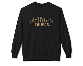 May include: Black crew neck sweatshirt with a yellow skyline graphic and the text "I HATE YINZ ALL". The sweatshirt is made of a soft material and is suitable for casual wear.