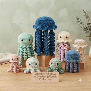 May include: A collection of eight crocheted jellyfish plush toys in various colors including blue, mint, pink, and cream, featuring spiral tentacles and dark eyes. A wooden sign in front reads: Oceanic Whimsy: A Crochet Jellyfish Collection.