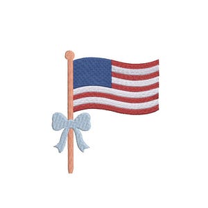 May include: Embroidered American flag with red and white stripes and a blue field of stars. The flag is attached to a wooden pole with a light blue bow. Patriotic theme.